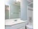 Well-lit bathroom with white vanity, framed mirror, toilet, and tiled shower at 101 Hedwig Ct, Cary, NC 27518