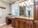 Bathroom featuring a granite countertop, makeup vanity, and glass shower at 101 Hedwig Ct, Cary, NC 27518