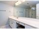 Bathroom featuring a vanity with a makeup area, large mirror, and a glass shower at 101 Hedwig Ct, Cary, NC 27518