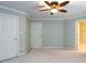 Bedroom featuring carpet flooring, a ceiling fan, and access to other rooms at 101 Hedwig Ct, Cary, NC 27518