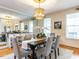 Elegant dining room with modern chandelier, large mirror, and seating for six, perfect for entertaining at 101 Hedwig Ct, Cary, NC 27518