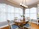 Inviting dining area with a wooden table, upholstered chairs, and a bright window at 101 Hedwig Ct, Cary, NC 27518