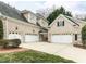 Home with a three-car garage and a spacious driveway, plus well maintained yard and landscaping at 101 Hedwig Ct, Cary, NC 27518