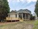Beautiful home exterior with a screened-in porch, wooden deck, and lush landscaping for outdoor enjoyment at 101 Hedwig Ct, Cary, NC 27518
