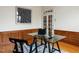 Well-appointed home office with custom wood paneling, glass desk, and door for privacy at 101 Hedwig Ct, Cary, NC 27518