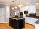 Beautiful kitchen featuring a center island cooktop, stainless steel appliances and custom cabinets at 101 Hedwig Ct, Cary, NC 27518