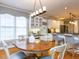 Bright eat-in kitchen with custom cabinets, granite counters, stainless appliances and wood floors at 101 Hedwig Ct, Cary, NC 27518