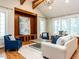 Spacious living room featuring vaulted ceiling, exposed beams, and hardwood floors at 101 Hedwig Ct, Cary, NC 27518