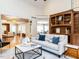 Cozy living room featuring hardwood floors, built in shelves, and stylish furniture at 101 Hedwig Ct, Cary, NC 27518