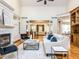 Bright living room with hardwood floors, fireplace, and stylish furniture with a view to other rooms at 101 Hedwig Ct, Cary, NC 27518