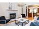 Living room featuring fireplace, stylish furniture, hardwood floors and an open floor plan at 101 Hedwig Ct, Cary, NC 27518