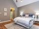 Main bedroom featuring vaulted ceiling, hardwood floors, ensuite bathroom and generous closet space at 101 Hedwig Ct, Cary, NC 27518