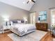Main bedroom featuring vaulted ceiling, hardwood floors, ensuite bathroom and generous closet space at 101 Hedwig Ct, Cary, NC 27518
