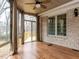 Bright sunroom with wood floors and views of the trees at 101 Hedwig Ct, Cary, NC 27518