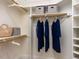 Walk-in closet with built-in shelving, clothing rods, and space for storage at 101 Hedwig Ct, Cary, NC 27518