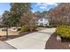 Lovely home with a circular driveway and well-manicured lawn, offering a grand and inviting entrance at 101 Settlecroft Ln, Holly Springs, NC 27540