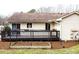 Backyard featuring a deck and a gardening box with plants at 103 Westview Dr # D, Carrboro, NC 27510