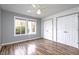 Cozy bedroom features new flooring, light grey walls, and lots of natural light at 103 Westview Dr # D, Carrboro, NC 27510