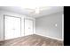Bedroom with laminate floors, neutral paint, and ample closet space at 103 Westview Dr # D, Carrboro, NC 27510