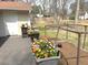 Deck with potted flowers and a view of a garden at 103 Westview Dr # D, Carrboro, NC 27510