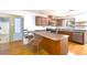 Well-equipped kitchen featuring a breakfast bar, stainless steel appliances, and ample counter space at 103 Westview Dr # D, Carrboro, NC 27510
