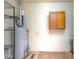 View of the utility room featuring a water heater, storage cabinet, and durable flooring at 103 Westview Dr # D, Carrboro, NC 27510