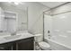 Clean bathroom featuring a combination shower and tub and a dark vanity with light countertop at 105 Hanover Ct, Clayton, NC 27527