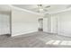 Carpeted primary bedroom with two closets and entryways to other rooms at 105 Hanover Ct, Clayton, NC 27527