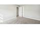Bedroom featuring a plush carpet, neutral paint, and entry to a connecting room at 105 Hanover Ct, Clayton, NC 27527