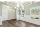 Dining area with hardwood flooring, decorative trim, and a view of the backyard at 105 Hanover Ct, Clayton, NC 27527