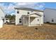 Rear exterior of the home with a covered patio, ideal for outdoor gatherings and relaxation at 105 Hanover Ct, Clayton, NC 27527
