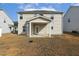 Rear exterior view featuring a covered patio, highlighting outdoor living and architectural details at 105 Hanover Ct, Clayton, NC 27527