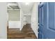 Welcoming foyer featuring hardwood floors, white wainscoting, and a view into the adjacent rooms at 105 Hanover Ct, Clayton, NC 27527