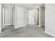 Hallway with soft carpeting, neutral paint, and access to other rooms in the house at 105 Hanover Ct, Clayton, NC 27527