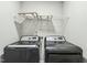 Laundry room equipped with modern washer and dryer and storage shelf above at 105 Hanover Ct, Clayton, NC 27527