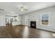 Open living area with fireplace, hardwood floors, and seamless access to the modern kitchen at 105 Hanover Ct, Clayton, NC 27527