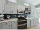 Well-equipped kitchen boasting modern appliances and ample counter space at 112 Theophilous, Holly Springs, NC 27540