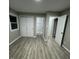 Spacious bedroom with closet and wood-look floors at 1128 Horseshoe Rd, Durham, NC 27703