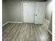 Cozy bedroom featuring wood-look flooring and a bright white interior at 1128 Horseshoe Rd, Durham, NC 27703