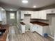 Spacious kitchen area featuring plentiful storage, butcher block countertops and modern appliances at 1128 Horseshoe Rd, Durham, NC 27703