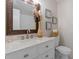 Bathroom features white marble countertop, large mirror, and toilet at 1206 Dubose St, Garner, NC 27529
