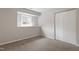 Bedroom featuring neutral carpet and a window and closet at 1206 Dubose St, Garner, NC 27529