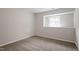 Bedroom featuring neutral carpet and a window offering natural light at 1206 Dubose St, Garner, NC 27529