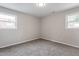 Bright bedroom with carpeted floor and natural light from windows at 1206 Dubose St, Garner, NC 27529
