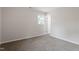 Bright bedroom with carpeted floor and natural light from a window at 1206 Dubose St, Garner, NC 27529