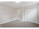 Bright bedroom with carpeted floor, a closet, and white walls at 1206 Dubose St, Garner, NC 27529