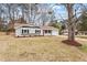 Well-maintained gray home with black shutters, red door, and an attached garage at 1206 Dubose St, Garner, NC 27529