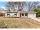 Attractive exterior of home featuring manicured landscaping and a bright red front door at 1206 Dubose St, Garner, NC 27529