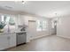 Modern kitchen with a stylish dining area with laminate floor at 1206 Dubose St, Garner, NC 27529