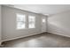 Living room features light wood floors and windows offering natural light at 1206 Dubose St, Garner, NC 27529